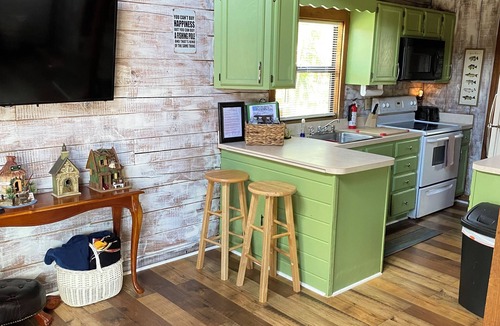 Okeechobee Cabin | Charming gingerbread style lakeside cabin on Lake Okeechobee
