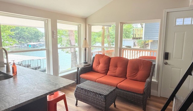 Cozy 740 sq ft A-frame cabin at North Shore Resort with lake views, 1 bedroom + loft (sleeps 6), full kitchen, island seating, and a private deck—perfect for relaxing getaways at Lake of the Ozarks.